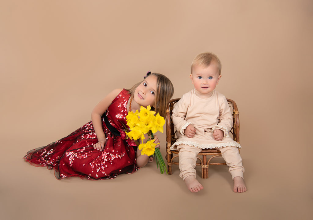 Kids photoshoot on solid color background